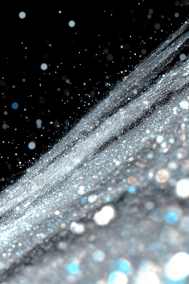 A mesmerizing close-up of sparkling silver glitter on a black background, with light reflections creating a magical, dynamic effect.